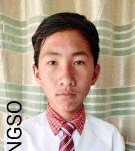 A young man wearing a tie and white shirt.