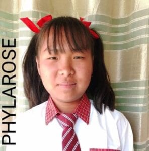 A young girl wearing a red tie and white shirt.