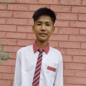 A young man wearing a red and white tie.