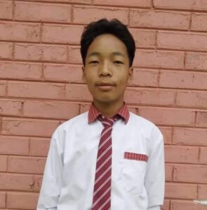 A young man wearing a tie and shirt.
