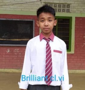 A young man wearing a tie and white shirt.