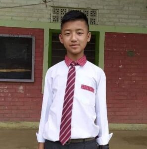 A young man in a tie and shirt.