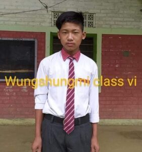 A man in a tie standing outside of a building.