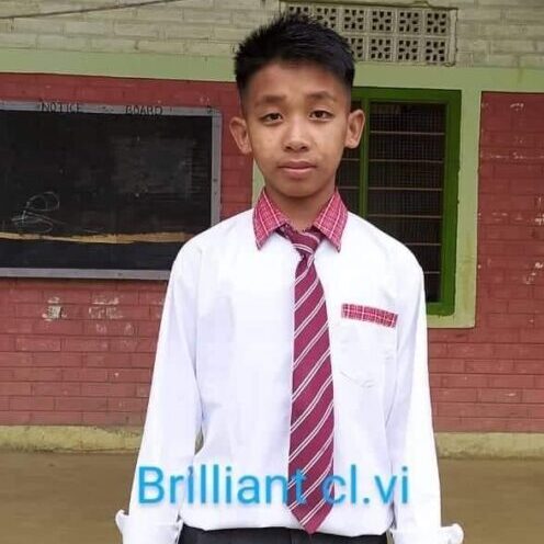 A young man wearing a tie and white shirt.