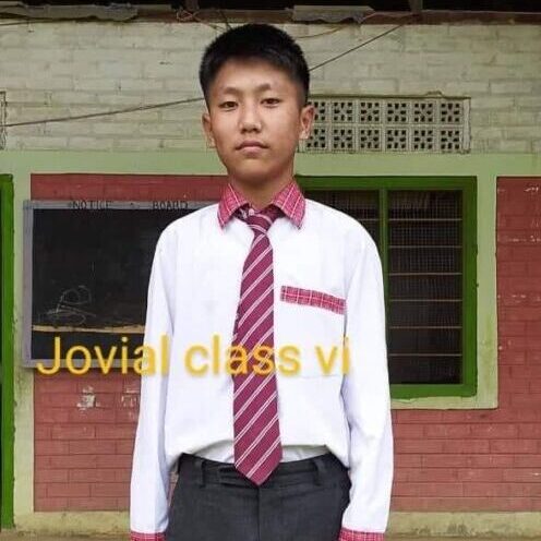 A young man wearing a tie and shirt.