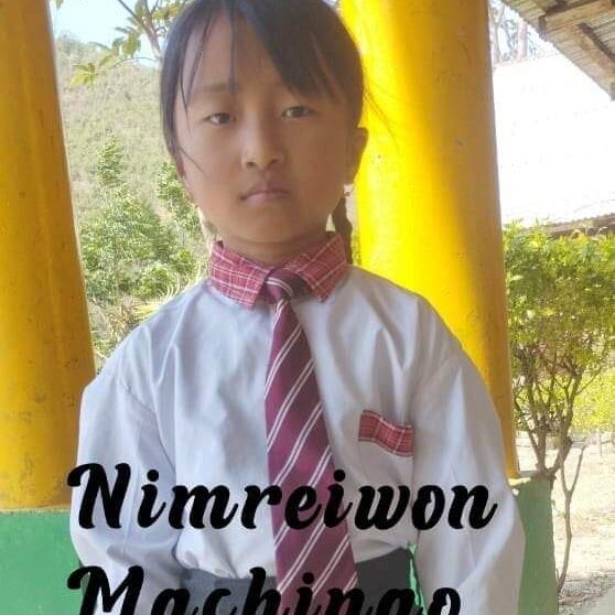 A young boy wearing a tie and standing in front of yellow walls.