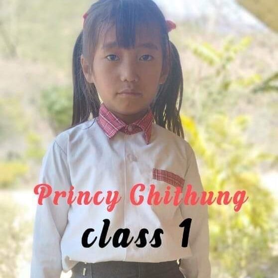 A girl in school uniform with the words " princy chitung class 1 ".
