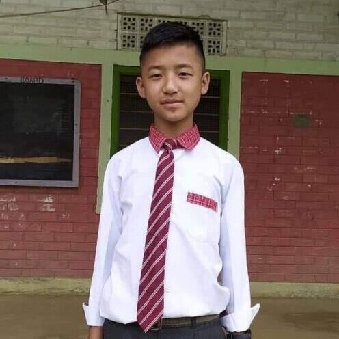 A young man in a tie and shirt.