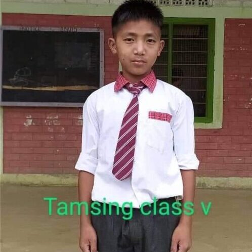 A boy in a tie and white shirt